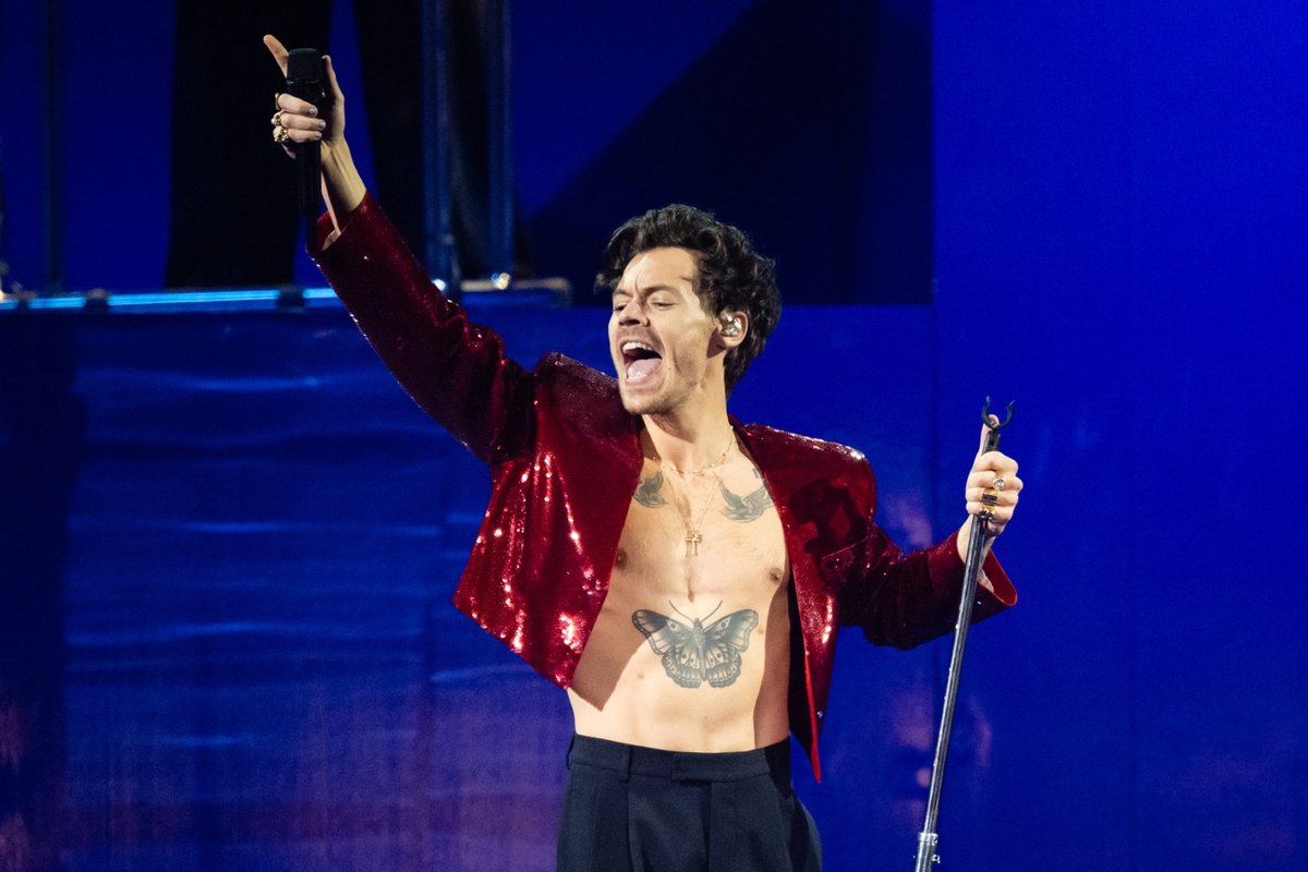 Harry Styles Channels 1970s Vibes with Iconic Mustache in London