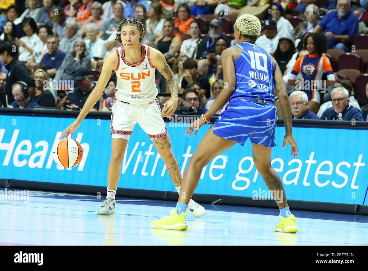 WNBA Stars Courtney Williams and Natisha Hiedeman Make Bold Statement with “Period Red” Hair